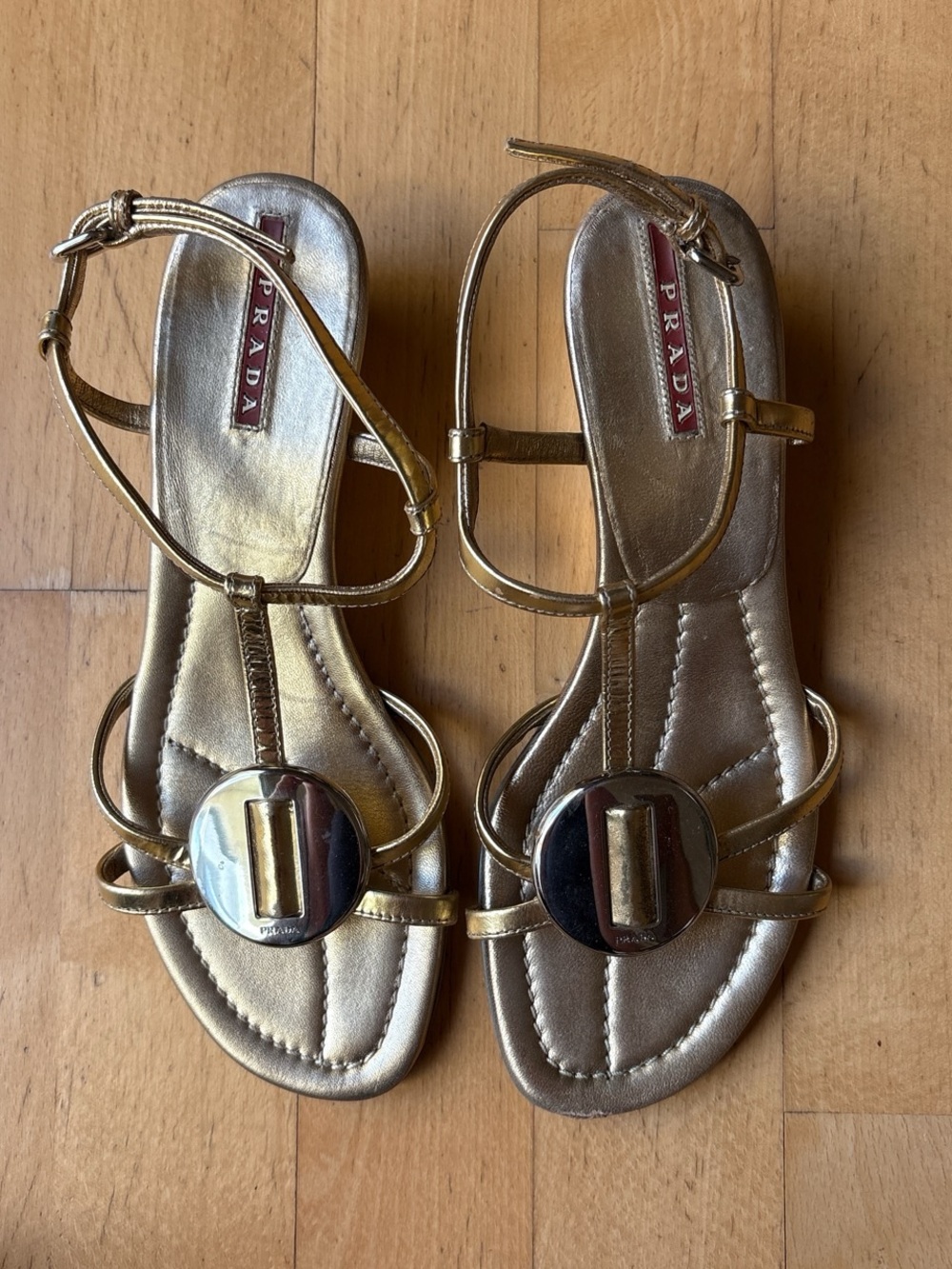 Prada Metallic Gold T-Strap Sandals with Medallion